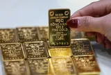 Giá vàng SJC giảm về mốc 166 triệu đồng