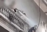 Clip người đàn ông xịt nước vào thợ xây nhà hàng xóm: Công an vào cuộc làm rõ